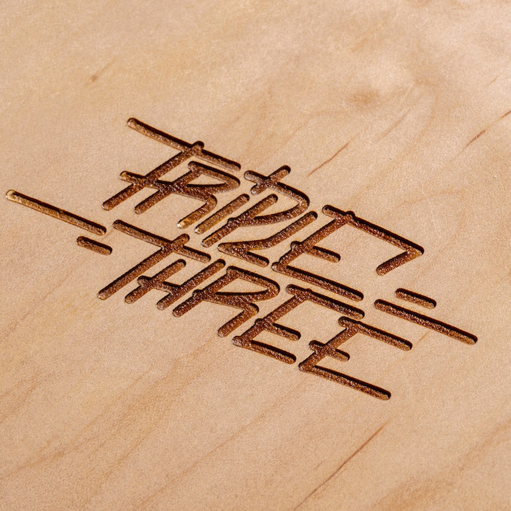 Engraved Wooden Side of our Triple 3 Popsicle Deck